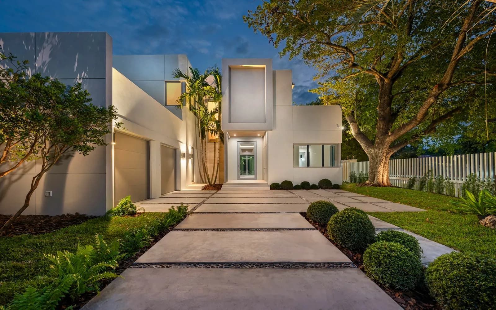 Contemporary luxury residence exterior with calm lighting and strong privacy planning
